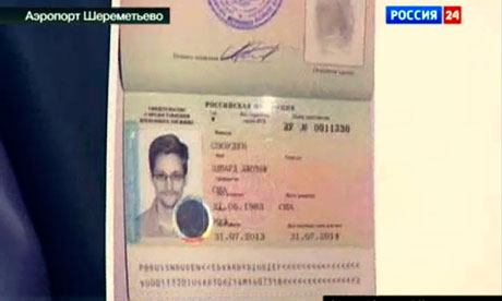 Anatoly Kucherena, Edward Snowden&apos;s lawyer, shows a copy of a temporary document allowing 