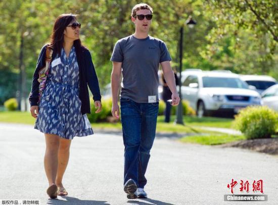 资料图：“脸书”创始人扎克伯格与华裔妻子Priscilla Chan。