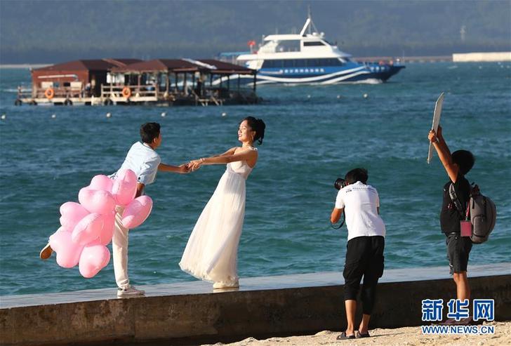 （社会）（1）分界洲岛：婚纱旅拍忙